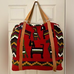 Vintage Carpet Bag 20” across bottom - 22” across top and 18” tall. Tan straps